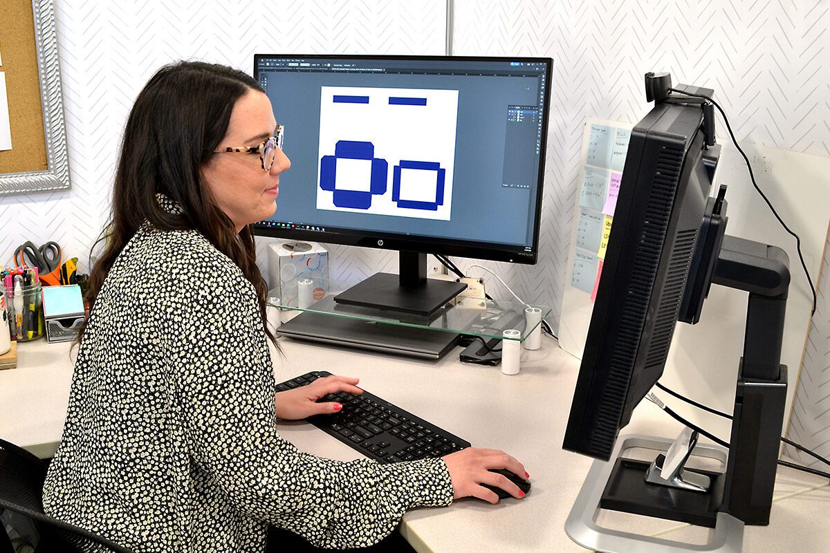 Female Designer Sitting at Computer