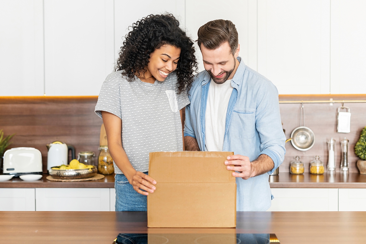 Man and Woman Opening a Box