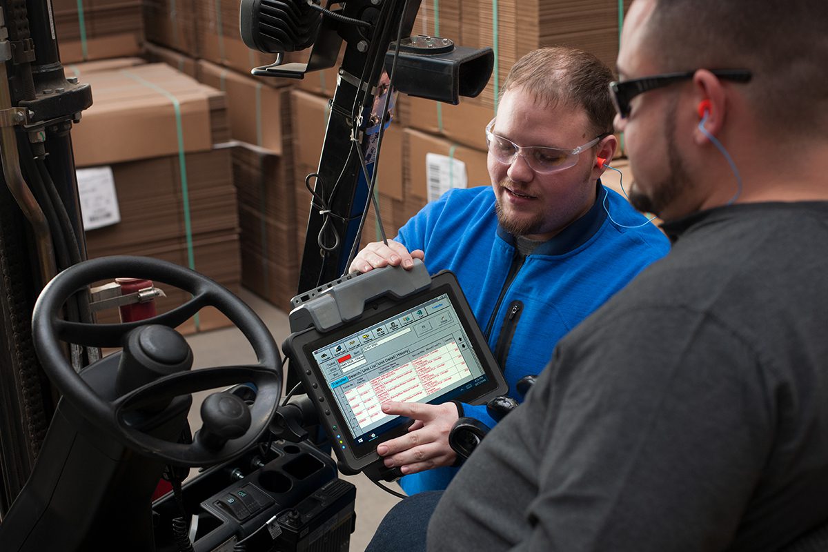 PCA Employees Looking at Forktruck Computer