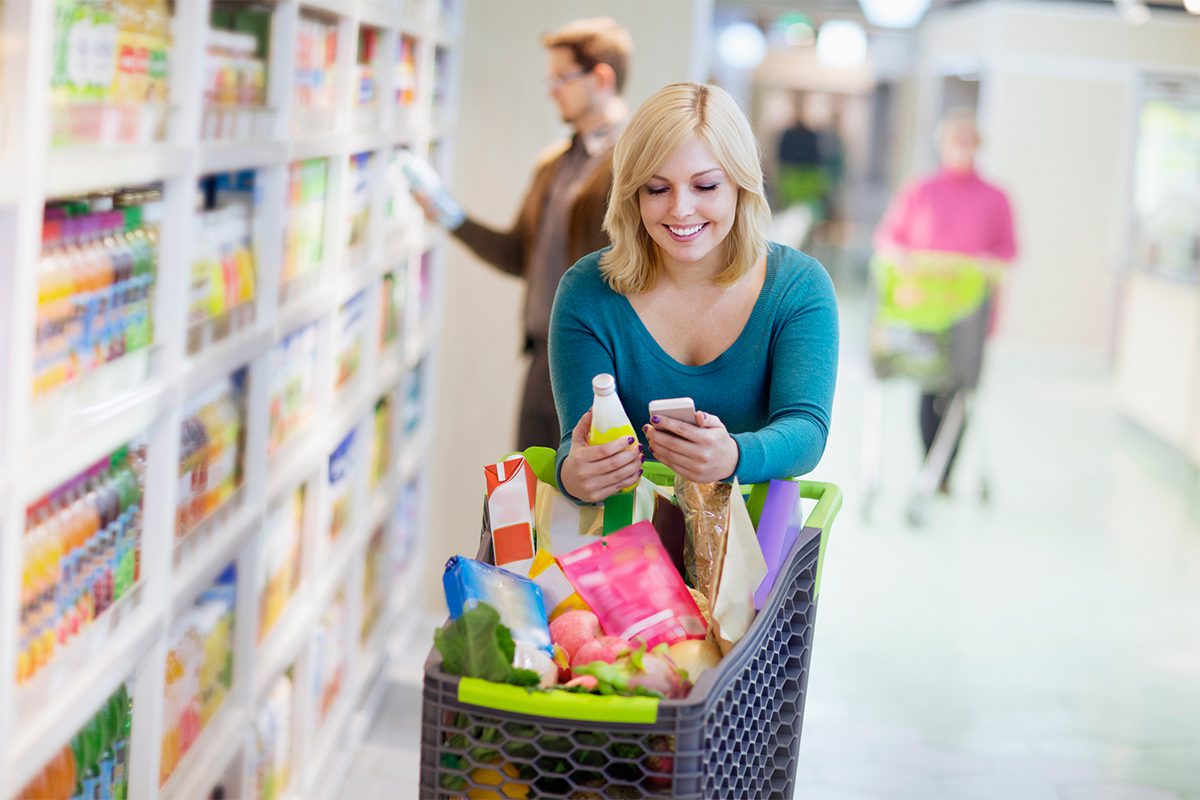 Woman With Full Shopping Cart