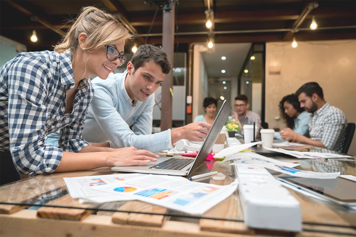 Designers Looking at a Laptop Screen