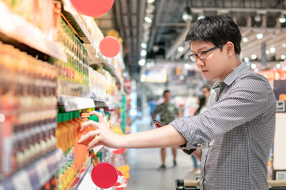 Man Pulling Grocery Product Off a Shelf