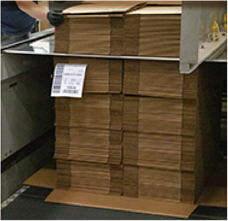 bundles of boxes being assembled into a unit load