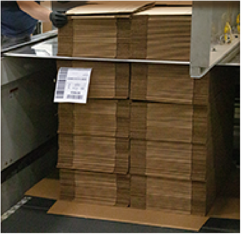 bundles of boxes being assembled into a unit load