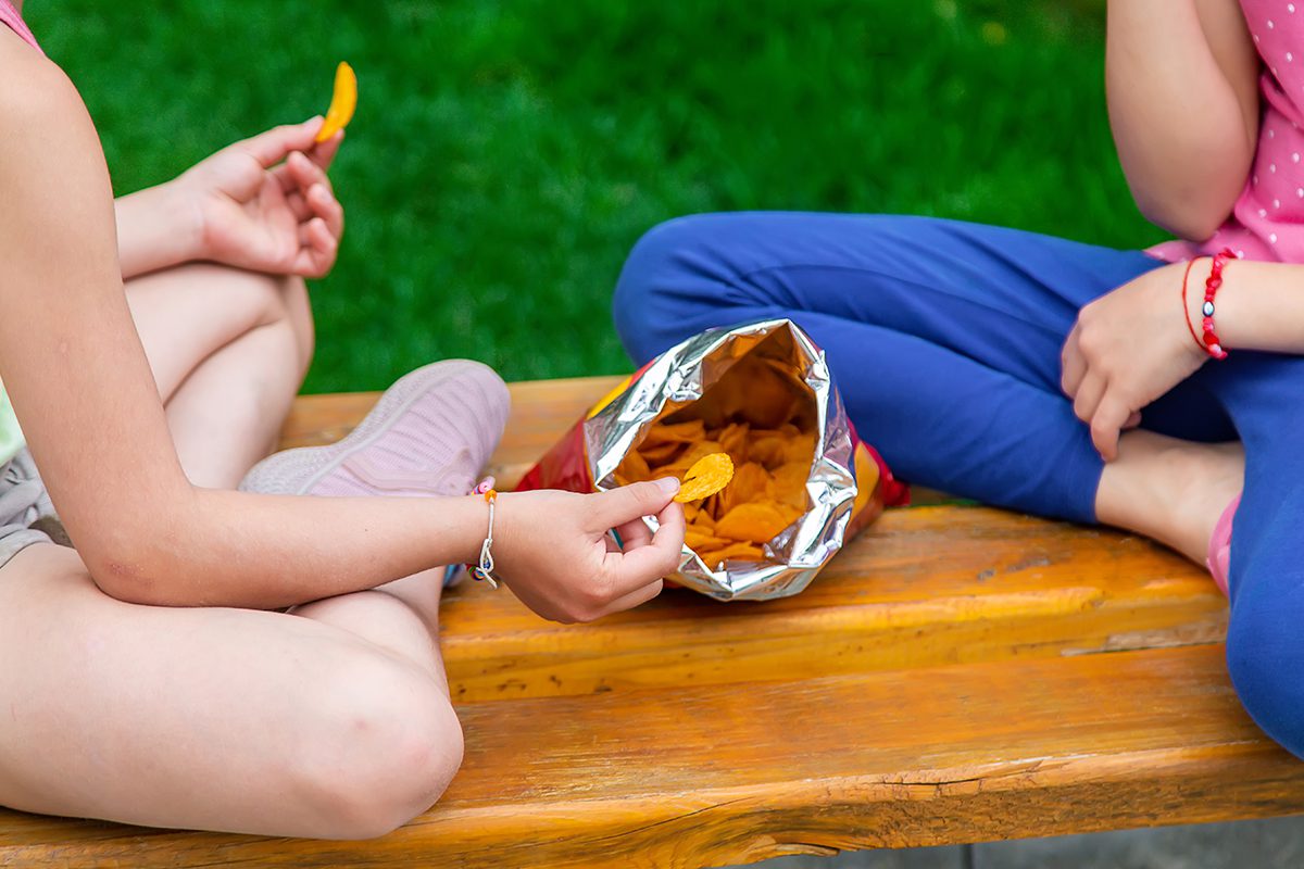 People Eating a Bag of Chips