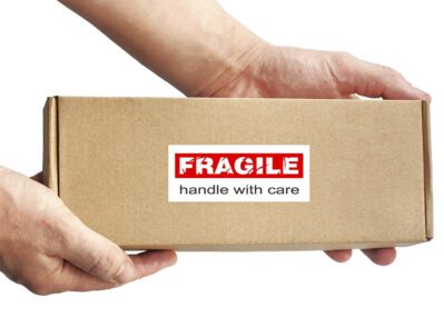 Hands Holding Fragile Box