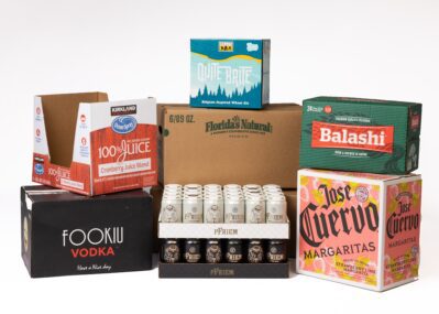 Grouping of corrugated boxes and trays for a variety of beverage types.