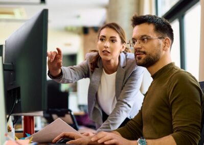 Two People Collaborating in an Office